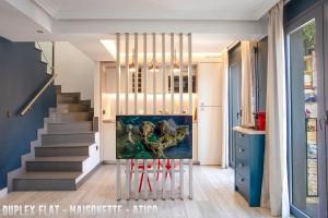 a staircase in a house with a painting on the wall at UNIQ flats in Alicante