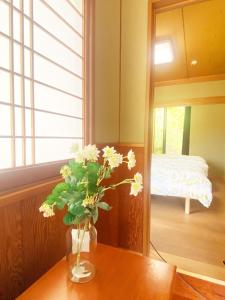 Postel nebo postele na pokoji v ubytování シークレットベースゆふいん