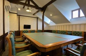 a conference room with a ping pong table and chairs at Midalidare Hotel & Spa in Mogilovo +34 photos