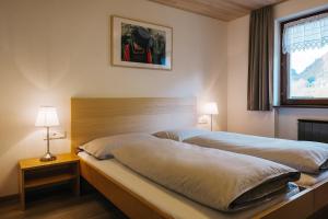 Posteľ alebo postele v izbe v ubytovaní Haus Margreth