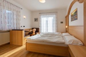 Postel nebo postele na pokoji v ubytování Villa Gemmy