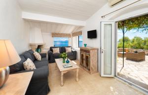 a living room with a couch and a table at The Saints - Terrace House in Nisaki