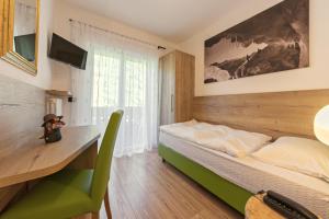 Postel nebo postele na pokoji v ubytování Villa Gemmy