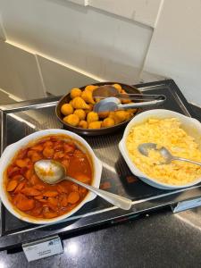 a tray with different types of food on a counter at Belo Horizonte Plaza in Belo Horizonte