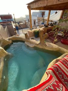 a large plunge pool in a resort with aiki at Surf & Salsa GuestHouse in Agadir