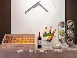 a box of wine and wine glasses and wine bottles at Hotel The Celestine Tokyo Shiba in Tokyo