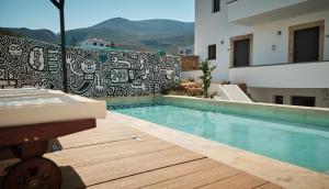a swimming pool in the middle of a building at Eden Kythira in Diakofti