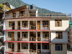 a building with balconies on the side of it at Octave Hillans Manali in Manāli