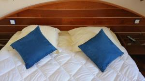 Postel nebo postele na pokoji v ubytování Hotel De La Mer