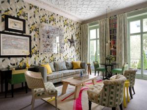 a living room with a couch and chairs and a table at Number Sixteen, Firmdale Hotels in London