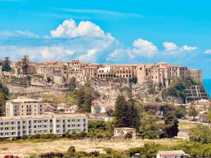 a town on a hill with buildings on it at Residence New Paradise in Tropea