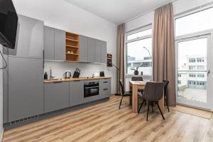 Kuchyň nebo kuchyňský kout v ubytování Charming Studio Apartment