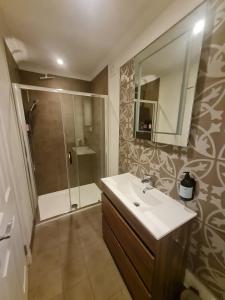 a bathroom with a sink and a shower at The Bridge House, Dunbar in Dunbar