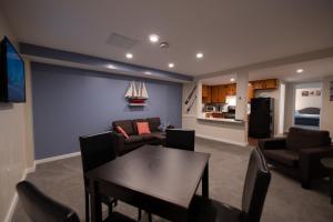 a living room with a table and a couch at Ledges By the Bay in Rockport