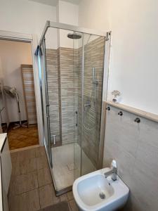 a bathroom with a shower and a sink at La nostra casa la vostra casa Cir00023 in Saint Vincent