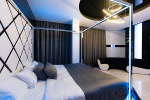 Кровать или кровати в номере Tsarsky Hotel