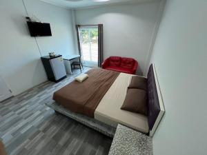 Postel nebo postele na pokoji v ubytování Nuttida resort ณัฐธิดา รีสอร์ท