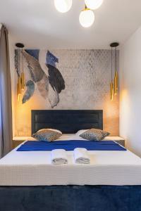 Ένα ή περισσότερα κρεβάτια σε δωμάτιο στο Villa Capitis in the center- Exclusive apartment