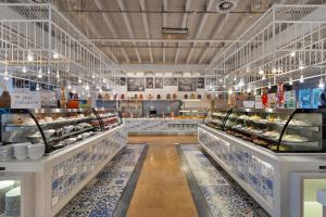 a bakery aisle with many different types of food at Ramada Plaza Antalya in Antalya