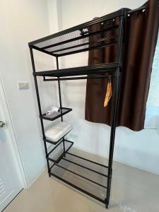 Postel nebo postele na pokoji v ubytování Nuttida resort ณัฐธิดา รีสอร์ท