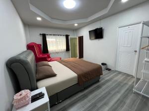 Postel nebo postele na pokoji v ubytování Nuttida resort ณัฐธิดา รีสอร์ท