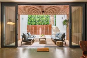 a living room with two chairs and a table at Ama Apartments in Lisbon