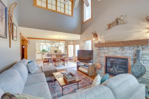 a living room with a couch and a fireplace at Ski-In and Ski-Out Townhome in Jay Peak Ski Resort! in Jay