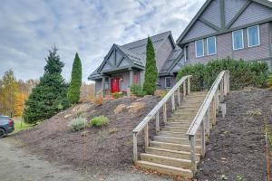 a house with a staircase in front of a house at Ski-In and Ski-Out Townhome in Jay Peak Ski Resort! in Jay