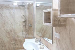 a bathroom with a sink and a shower at Blue and Blue in Torre San Giovanni Ugento