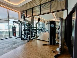 a gym with treadmills and exercise equipment in a building at Viia@Eco kl city#Mid Velly in Kuala Lumpur