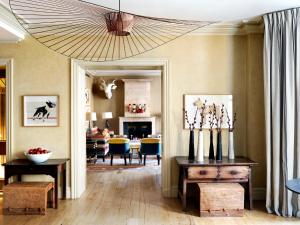 a living room with a large chandelier and a living room at Knightsbridge Hotel, Firmdale Hotels in London