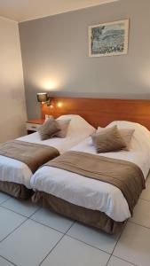 Postel nebo postele na pokoji v ubytování Hotel Restaurant Miramar L'orchidée