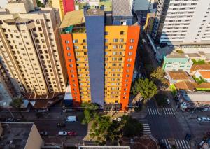 an overhead view of an orange building in a city at Slaviero Curitiba Shopping in Curitiba