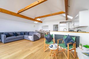 a living room with a couch and chairs at Fisherman's Croft Your Dream Getaway Awaits in Pevensey