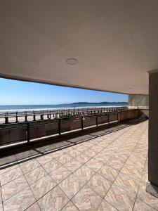 a view of the beach from a building at APARTAMENTO FRENTE MAR in Itapema