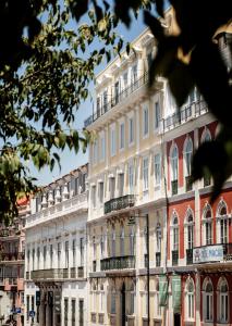 a large white building with a lot of windows at Casa do Principe in Lisbon