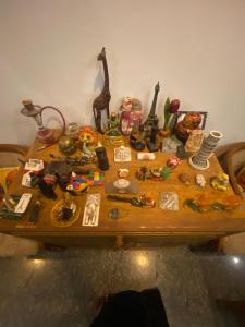 a table with a bunch of items on it at Casa De Neel in Puducherry