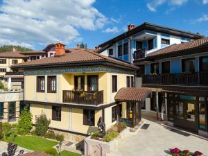 a group of houses in a city at Armaco Residence in Koprivshtitsa