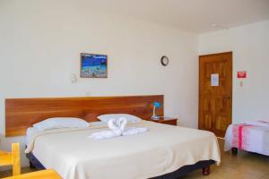 Postel nebo postele na pokoji v ubytování Galapagos Verde Azul