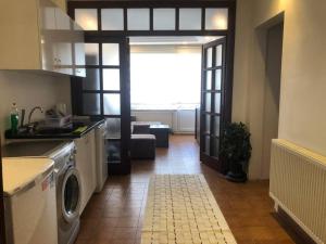 a kitchen with a washing machine and a living room at Beyoğlu/Taksim are also in a perfect location in Istanbul