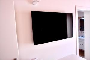 TV a/nebo společenská místnost v ubytování Una Vita In Vacanza