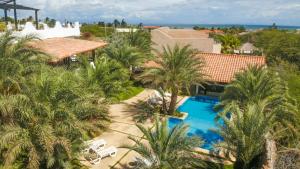 an aerial view of a resort with a swimming pool and palm trees at Playa El YAQUE Posada Yaque Sol, Isla de Margarita in El Yaque