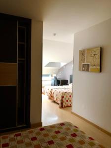 Postel nebo postele na pokoji v ubytování Hotel Villa de Cacabelos