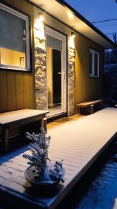 a house with a swimming pool in the snow at Amapola Tiny House in San Carlos de Bariloche