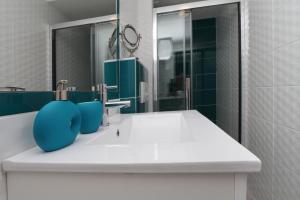 a bathroom with a sink and a mirror at Modern Apartments in Makarska