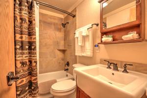 a bathroom with a sink and a toilet and a sink at Yellowstone Gateway Inn in Gardiner