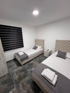Ένα ή περισσότερα κρεβάτια σε δωμάτιο στο Apartmani River Priboj