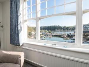 a window with a view of a marina at Quayside in Dartmouth