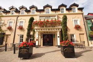a building with flowers in front of it at The Fairview Boutique Hotel in Killarney