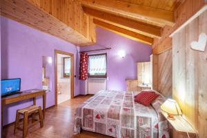 Postel nebo postele na pokoji v ubytování Agriturismo La Clochette